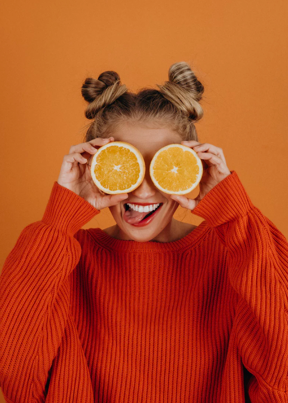 Portrait of girl on orange background